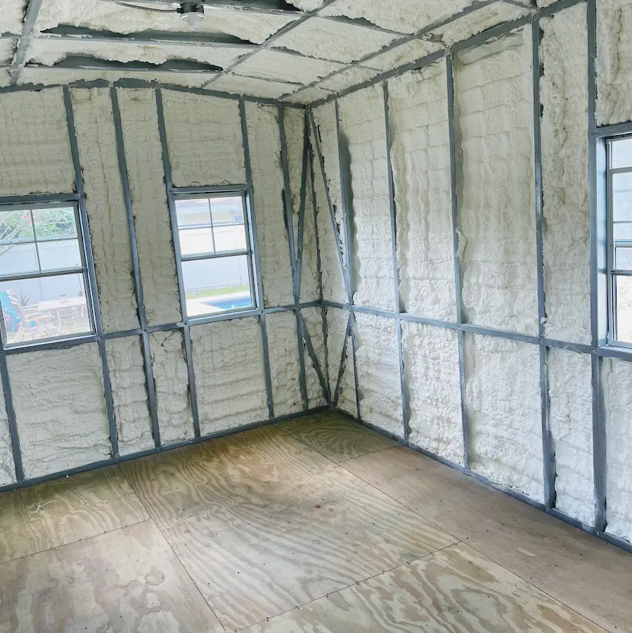 Closed-cell spray foam insulation applied to wall cavities in a residential project in Johnston
